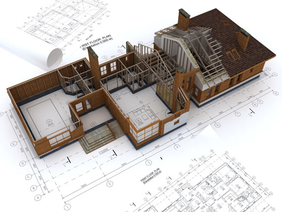 Vista superior de maqueta en una planta sin techo con planos esparcidos al rededor